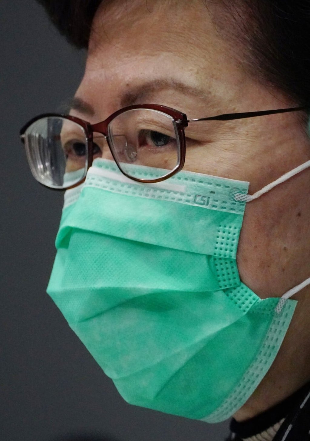 Chief Executive Carrie Lam wears a mask stamped with CSI. Photo: Robert Ng