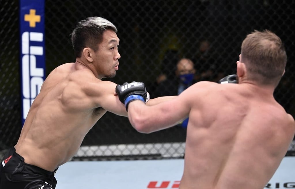 Takashi Sato punches Jason Witt during UFC Fight Night.