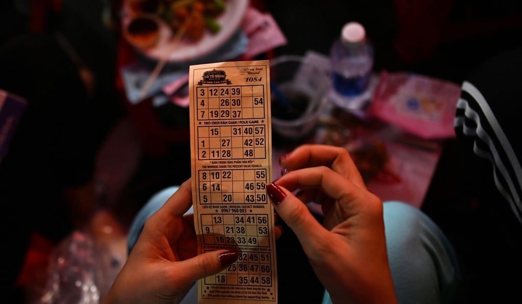 A woman plays a game of lotto at one of the ‘Sai Gon Tan Thoi’ LGBT troupe’s show. Photo: AFP A woman plays a game of lotto at one of the ‘Sai Gon Tan Thoi’ LGBT troupe’s show. Photo: AFP