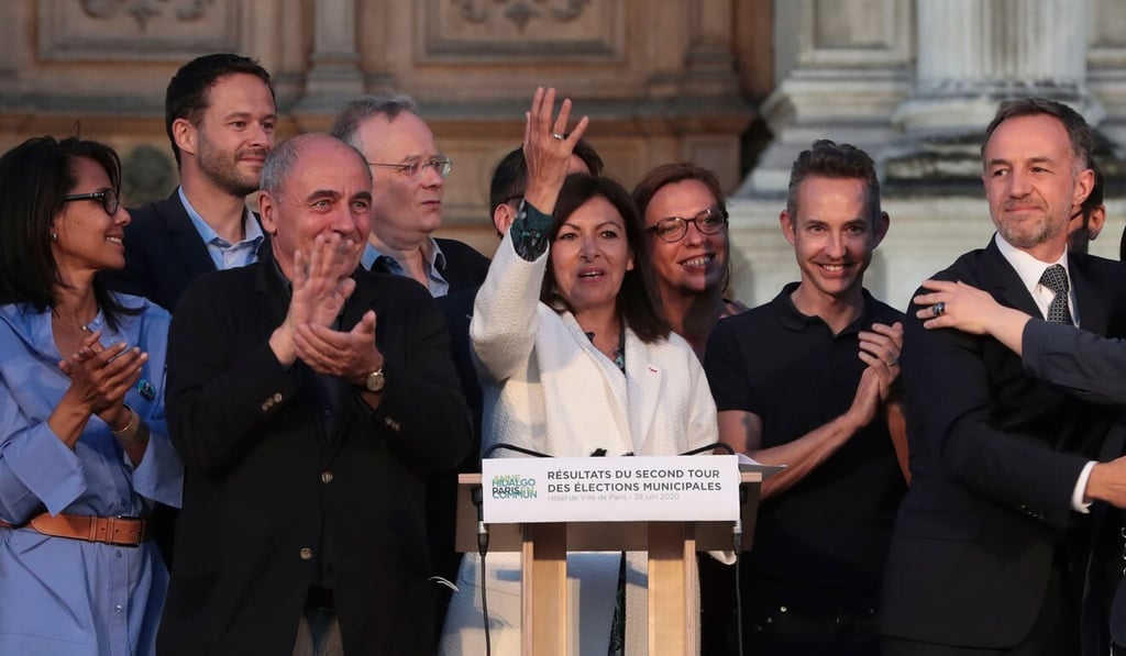 Paris’s incumbent Mayor and candidate for the socialist Party (PS) Anne Hidalgo (C) reacts after delivering a speech following her re-election in the 2020 mayoral elections at the Hotel de Ville in Paris. Photo: AFP