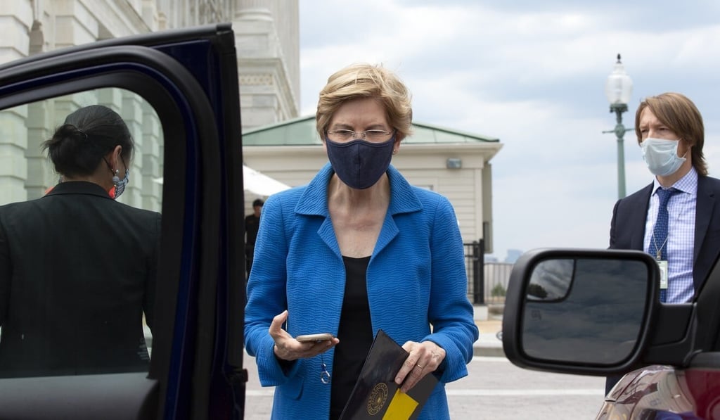 Senator Elizabeth Warren wears a protective mask while leaving the US Capitol on Thursday. Photo: Bloomberg Senator Elizabeth Warren wears a protective mask while leaving the US Capitol on Thursday. Photo: Bloomberg