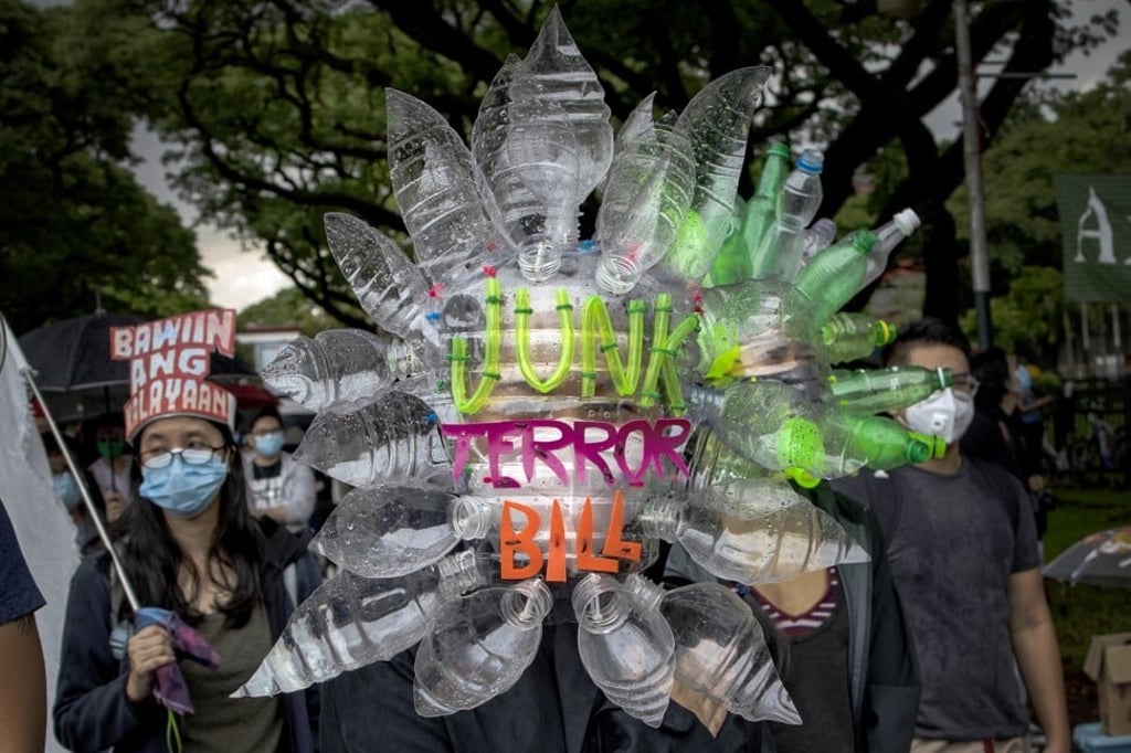 A woman wearing a face mask made of recycled plastic bottles takes part in a protest against President Duterte’s anti-terrorism bill in Quezon City, Metro Manila. Photo: Getty Images