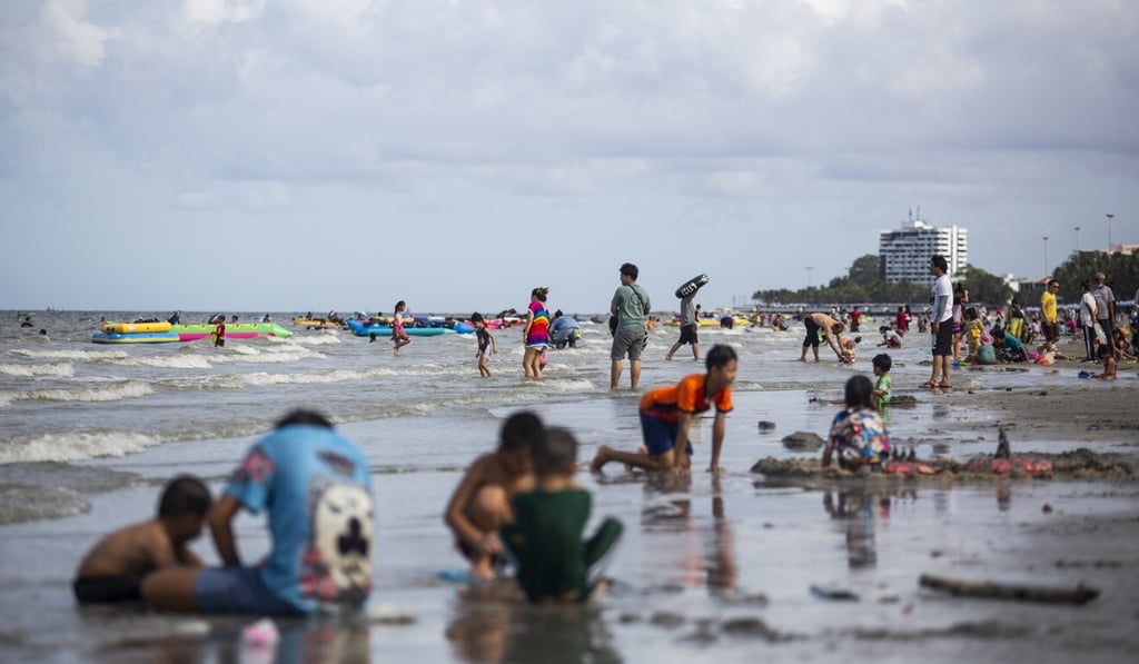 Domestic visitors relax on a beach in Chonburi, Thailand, on June 14. Photo: Bloomberg Domestic visitors relax on a beach in Chonburi, Thailand, on June 14. Photo: Bloomberg