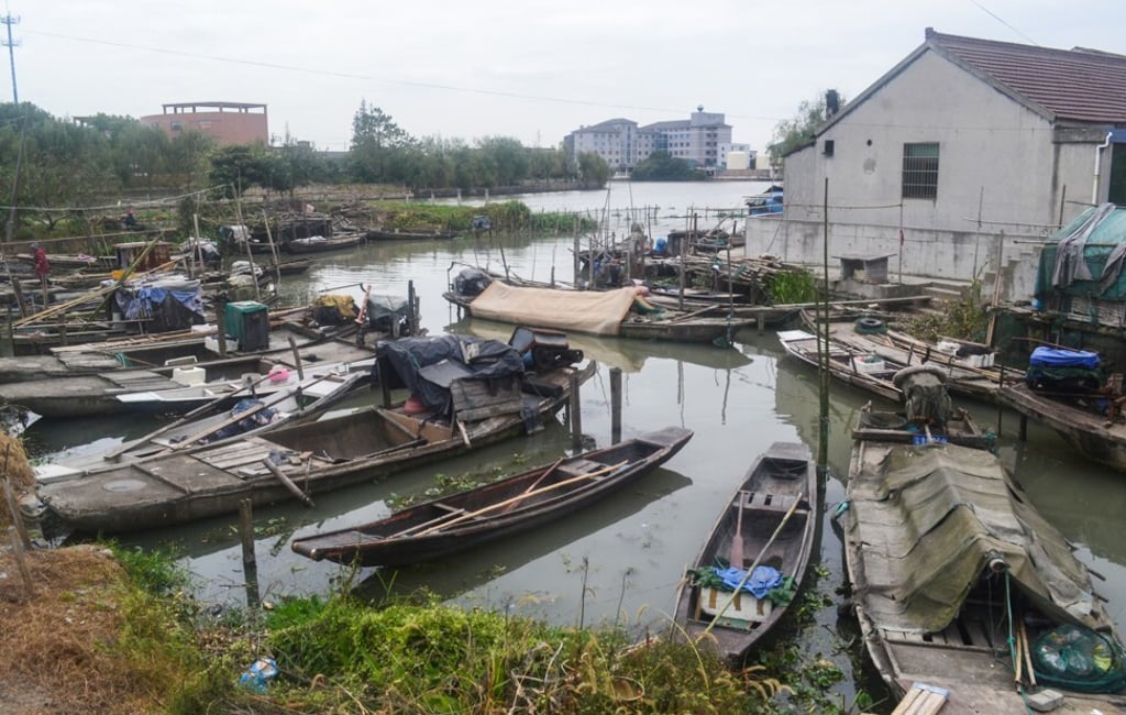 Fishing boats line the riverbank in Yucheng, Zhejiang province, which was supposed to be the site for “Happy Town”, a themed project that was to include a sex toy shopping street, a sex exhibition centre and an “adult-only” hotel. Photo: Sidney Leng Fishing boats line the riverbank in Yucheng, Zhejiang province, which was supposed to be the site for “Happy Town”, a themed project that was to include a sex toy shopping street, a sex exhibition centre and an “adult-only” hotel. Photo: Sidney Leng