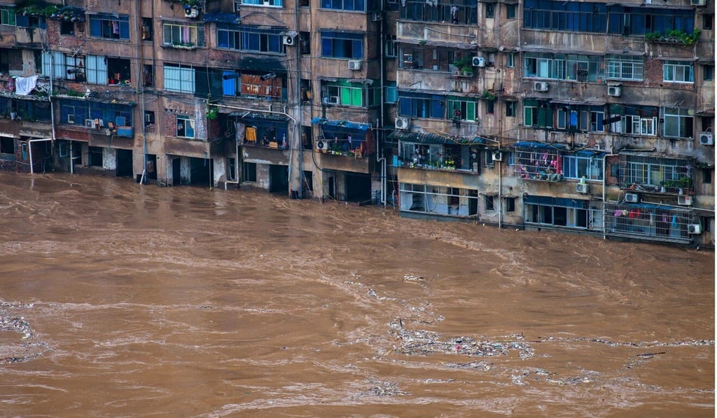 Floods strike a residential area in Chongqing in southwest China on July 1. Photo: Xinhua Floods strike a residential area in Chongqing in southwest China on July 1. Photo: Xinhua