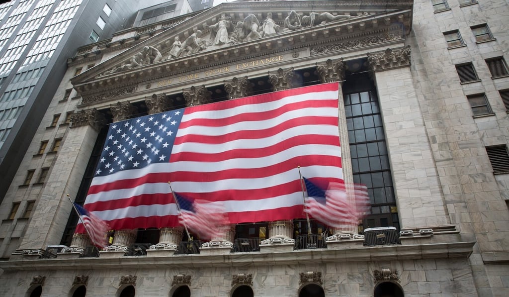 The American flag in front of the New York Stock Exchange. Photo: Xinhua The American flag in front of the New York Stock Exchange. Photo: Xinhua