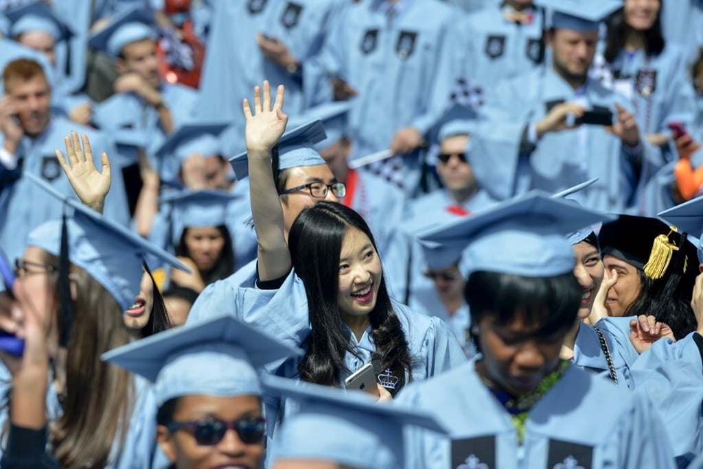 Chinese graduates of Columbia University attend the commencement ceremony in New York City. Photo: Corbis