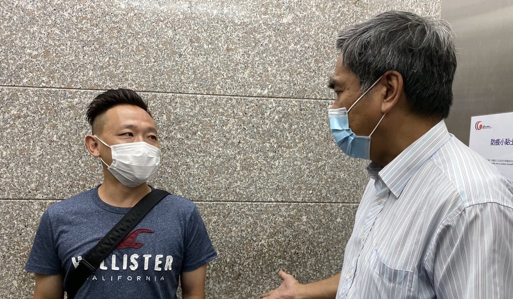 Wofoo Tai Po secretary Chan Ping (right) and former coach Fung Hoi-man meet at the Labour Department. Photo: Chan Kin-wa