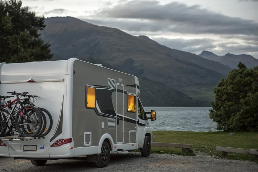 A motorhome parks at dusk at the Boundary Creek Campsite, next to Lake Wanaka in South Westland, New Zealand. Photo: Getty Images