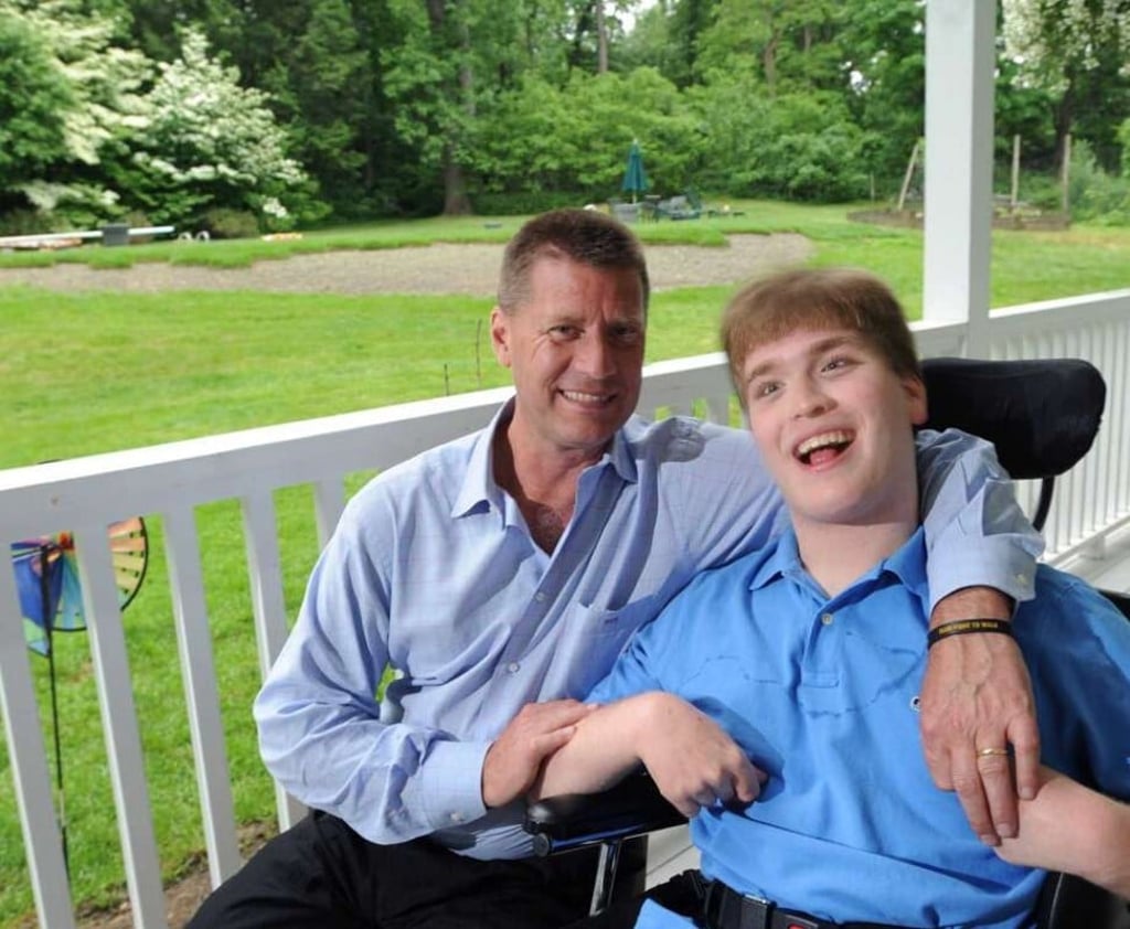 Fred Trump III with his disabled son. Photo: @DebErupts/Twitter