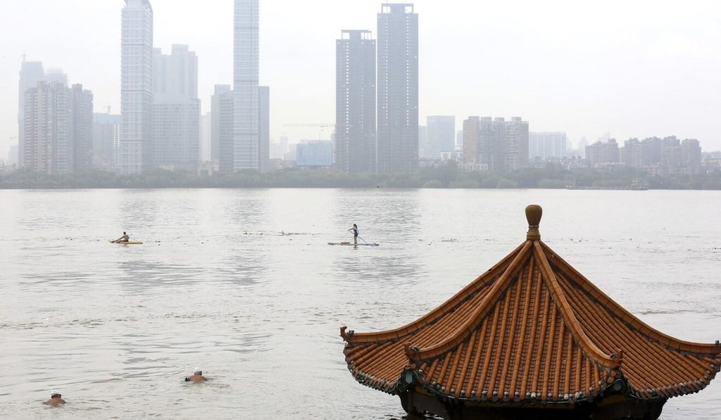 A submerged riverside pavilion in Wuhan, just months after the central Chinese city was devastated by the coronavirus pandemic. Photo: EPA-EFE A submerged riverside pavilion in Wuhan, just months after the central Chinese city was devastated by the coronavirus pandemic. Photo: EPA-EFE