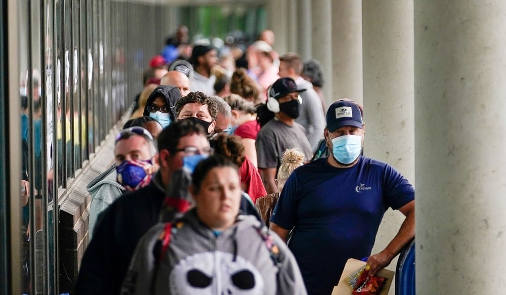 Hundreds of people line up outside a Kentucky Career Centre hoping to find assistance with their unemployment claims in Frankfort, on June 18. The US has added 7.5 million new jobs in the past two months. Photo: Reuters Hundreds of people line up outside a Kentucky Career Centre hoping to find assistance with their unemployment claims in Frankfort, on June 18. The US has added 7.5 million new jobs in the past two months. Photo: Reuters