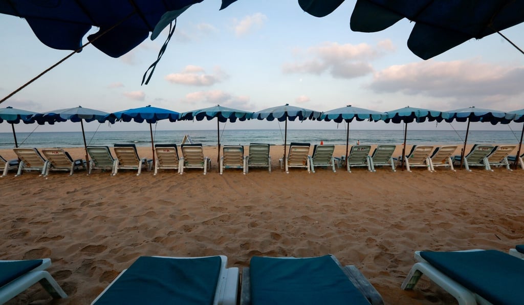Empty chairs are seen on a beach in Thailand’s Phuket which would usually be full of tourists amid the pandemic in March. Photo: Reuters