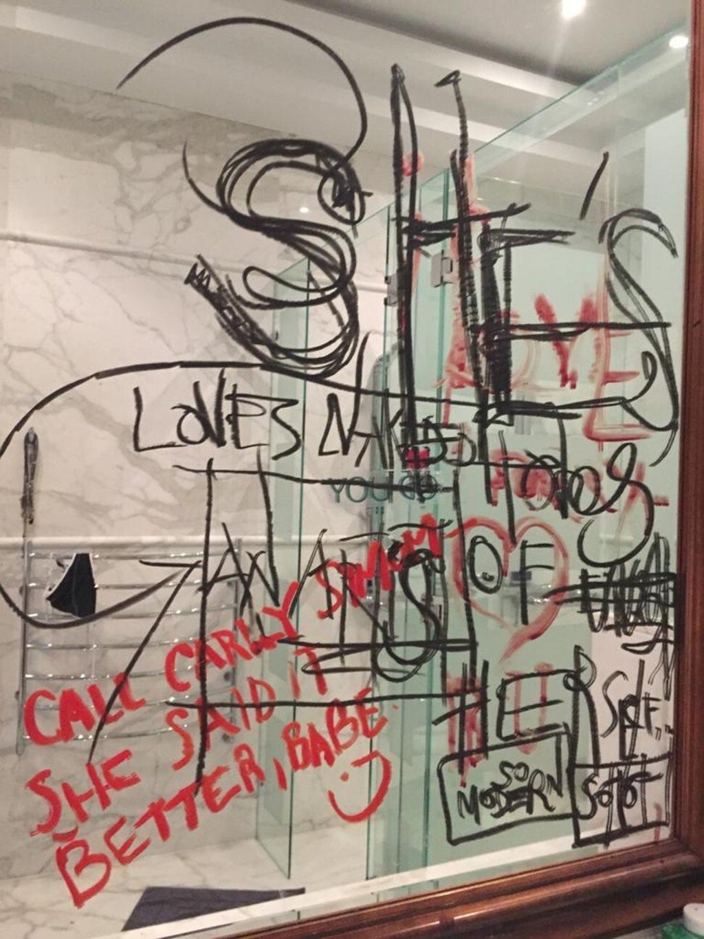 An undated photograph showing writing done with Johnny Depp's severed finger was presented as evidence on Thursday. Photo: High Court via Reuters