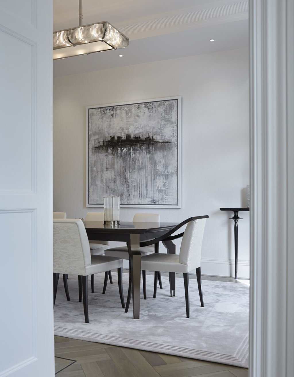 Large scale art makes a small dining room feel more expansive. Photo: handout