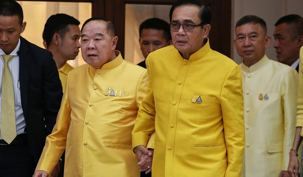 Thai Prime Minister Prayuth Chan-ocha, right, holds hands with Deputy Prime Minister and Defence Minister Prawit Wongsuwan at Government House in Bangkok last year. Photo: Reuters