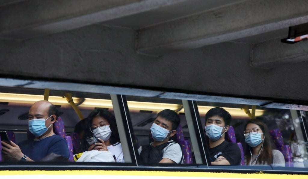 Amid a spike in Covid-19 cases that some experts have called the worst yet, Hongkongers are now legally required to wear masks on public transport. Photo: K. Y. Cheng