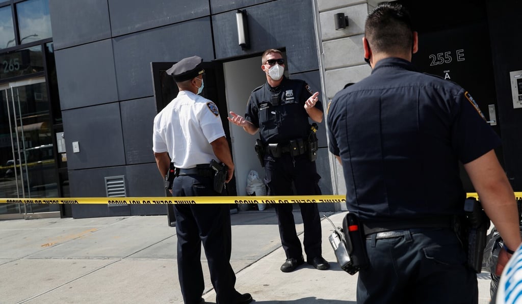 Police officers speak outside the New York apartment building where Gokada CEO Fahim Saleh was found dead on Wednesday. Photo: Reuters Police officers speak outside the New York apartment building where Gokada CEO Fahim Saleh was found dead on Wednesday. Photo: Reuters