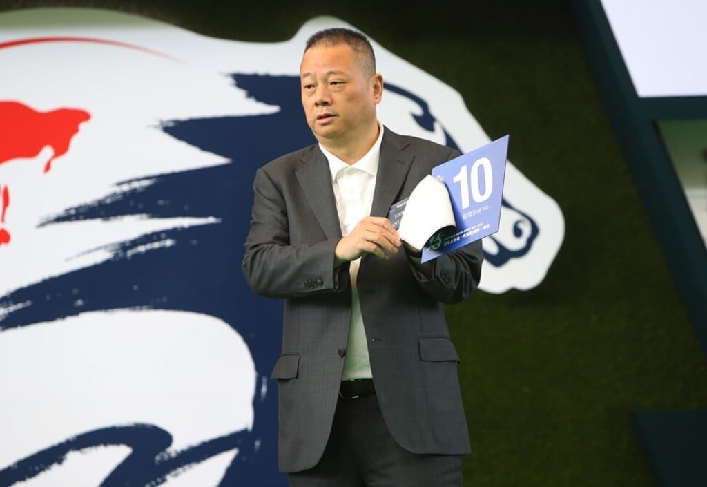 Pan Sutong, billionaire developer and owner of a race horse, draws the barrier No 10 at Sha Tin Racecourse Parade Ring on December 8, 2016. Photo: SCMP