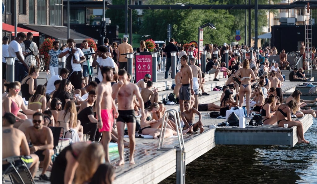 Swedes flock outdoors to enjoy warm summer weather in Stockholm. Photo: EPA-EFE