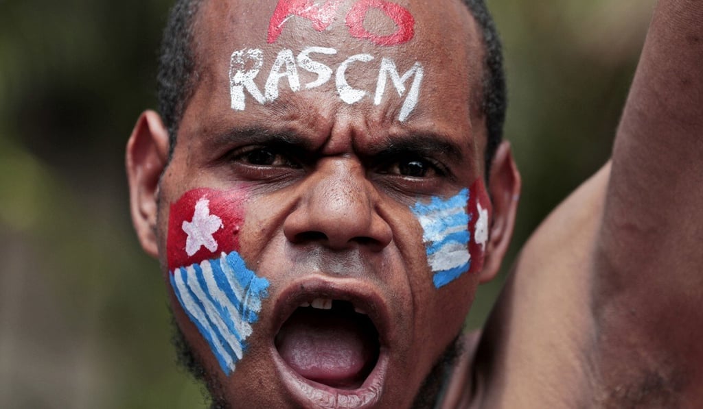 A Papuan activist with a separatist flag painted on his face demonstrates during last year’s anti-racism protests, which Indonesia responded to with internet blackouts. Photo: AP
