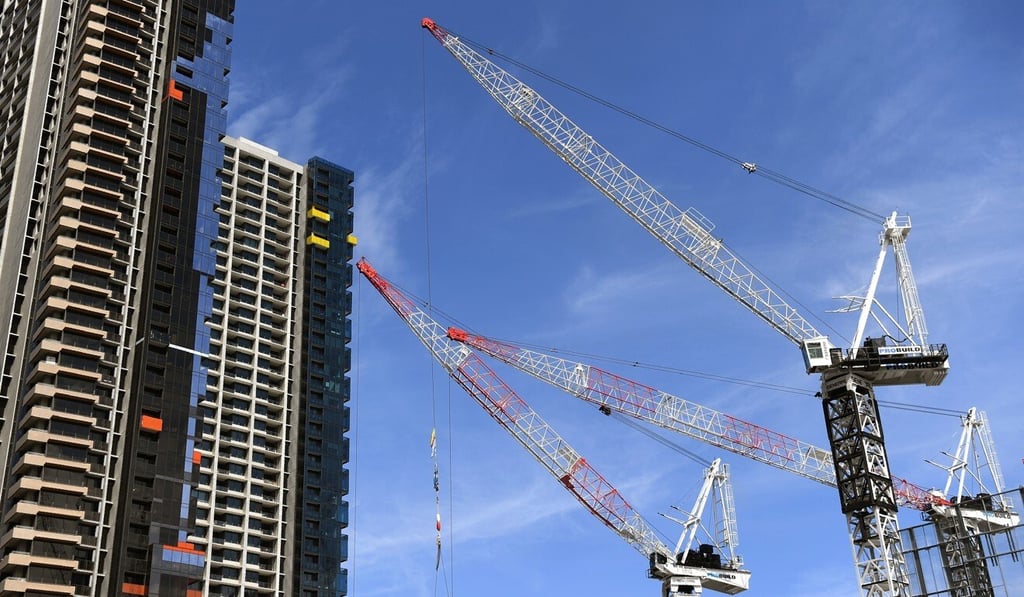 Cranes work on a building site in Melbourne’s central business district. Photo: AFP Cranes work on a building site in Melbourne’s central business district. Photo: AFP