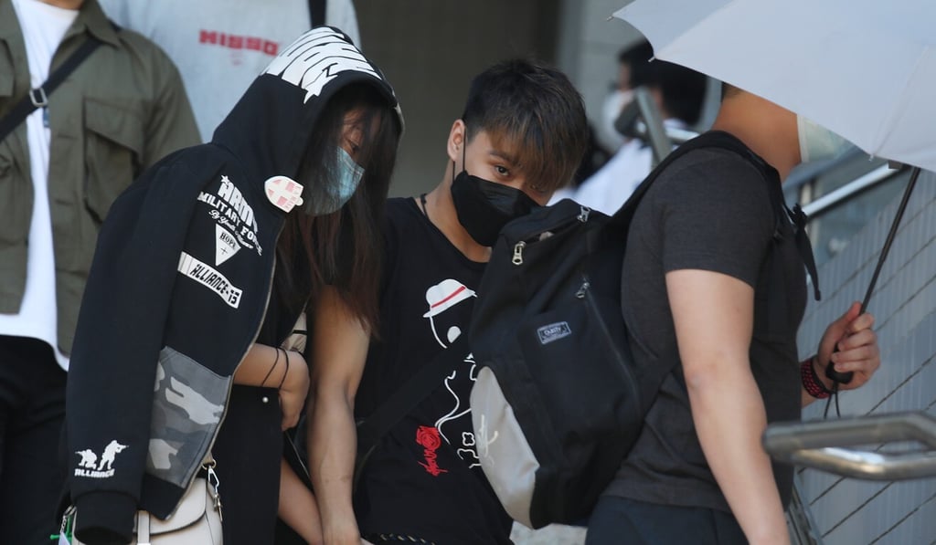 Lin Chun-hung (centre) appears at Kowloon City Court accused of rioting, among other charges. Photo: Xiaomei Chen