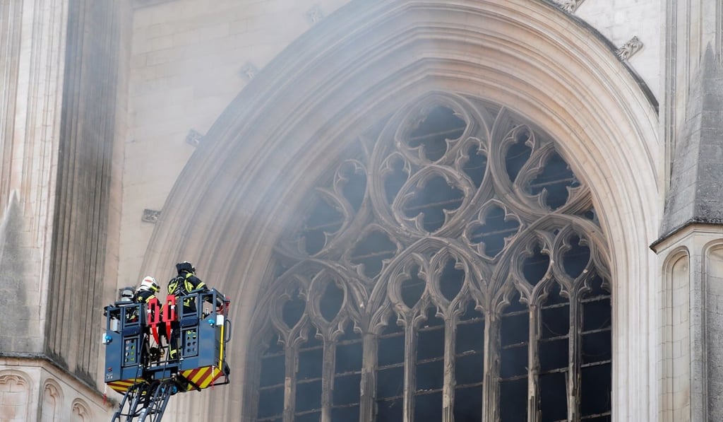 French firefighters battle a blaze at the Cathedral of Saint Pierre and Saint Paul in Nantes. Photo: Reuters