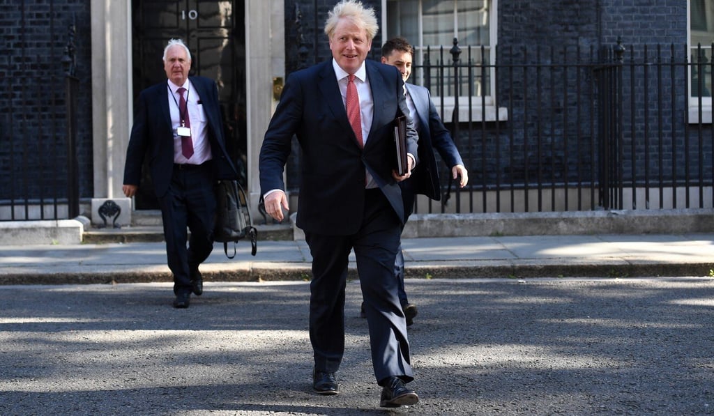 British Prime Minister Boris Johnson departs 10 Downing Street on July 21 after his first face-to-face cabinet meeting in four months. Photo: EPA-EFE British Prime Minister Boris Johnson departs 10 Downing Street on July 21 after his first face-to-face cabinet meeting in four months. Photo: EPA-EFE