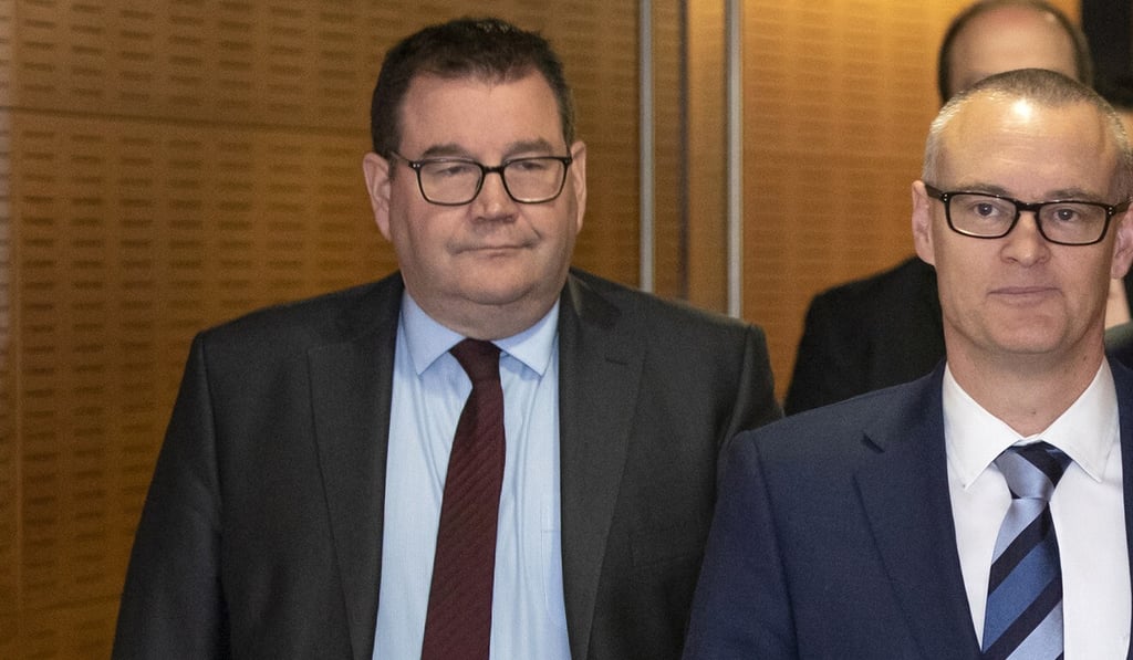 New Zealand’s Finance Minister Grant Robertson, left, was initially meant to go on the Antarctica trip. Photo: New Zealand Herald via AP New Zealand’s Finance Minister Grant Robertson, left, was initially meant to go on the Antarctica trip. Photo: New Zealand Herald via AP