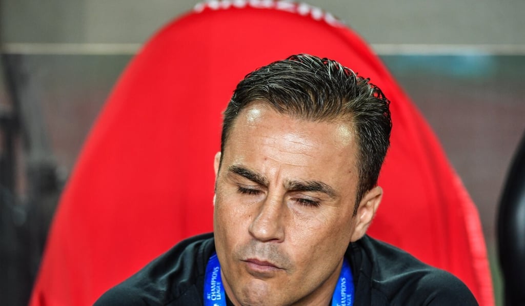 Guangzhou Evergrande coach Fabio Cannavaro leads the team in the CSL kick-off in Dalian. Photo: Xinhua