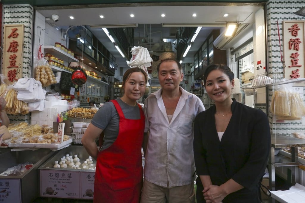 Tate Dining’s Vicky Lau (right) with Kung Wo Beancurd Factory owner So Sung-lin (centre) and his daughter, director Renee So, outside the shop. Photo: Jonathan Wong