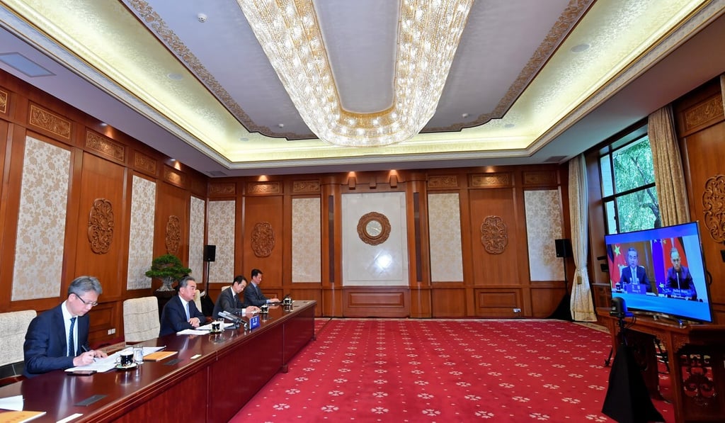 Chinese Foreign Minister Wang Yi (second from left) chats with German Foreign Minister Heiko Maas via a video link in Beijing on Friday. Photo: Xinhua