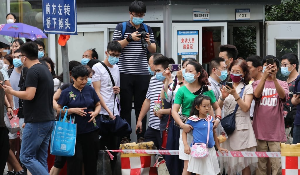 Despite having to put up with a bit of rain, the large crowd was mostly good-natured. Photo: Simon Song