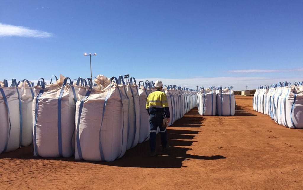 A Lynas worker walks past sacks of rare earth concentrate at Mount Weld, Perth. File photo: Reuters