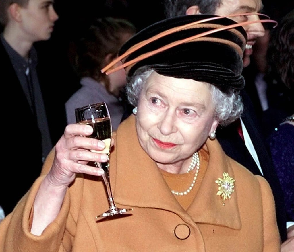Queen Elizabeth raises a glass to welcome in the new millennium in 2000. Photo: AP