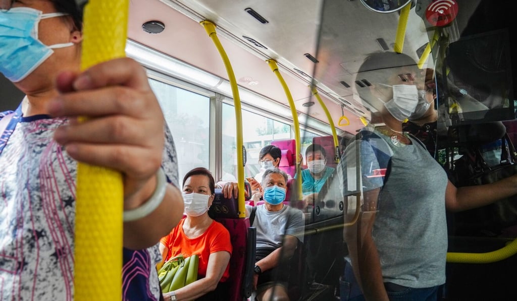Bus commuters wearing face masks in Wong Tai Sin, which has been hard hit by the latest wave of the Covid-19 outbreak. Photo: Sam Tsang