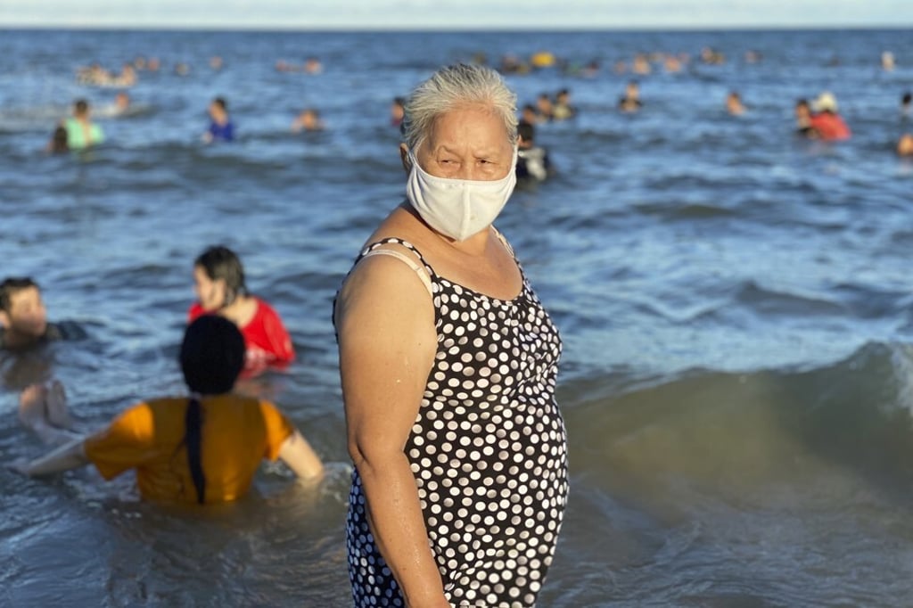 People seen at a beach in Vung Tau city, Vietnam, on July 26, 2020. Photo: AP