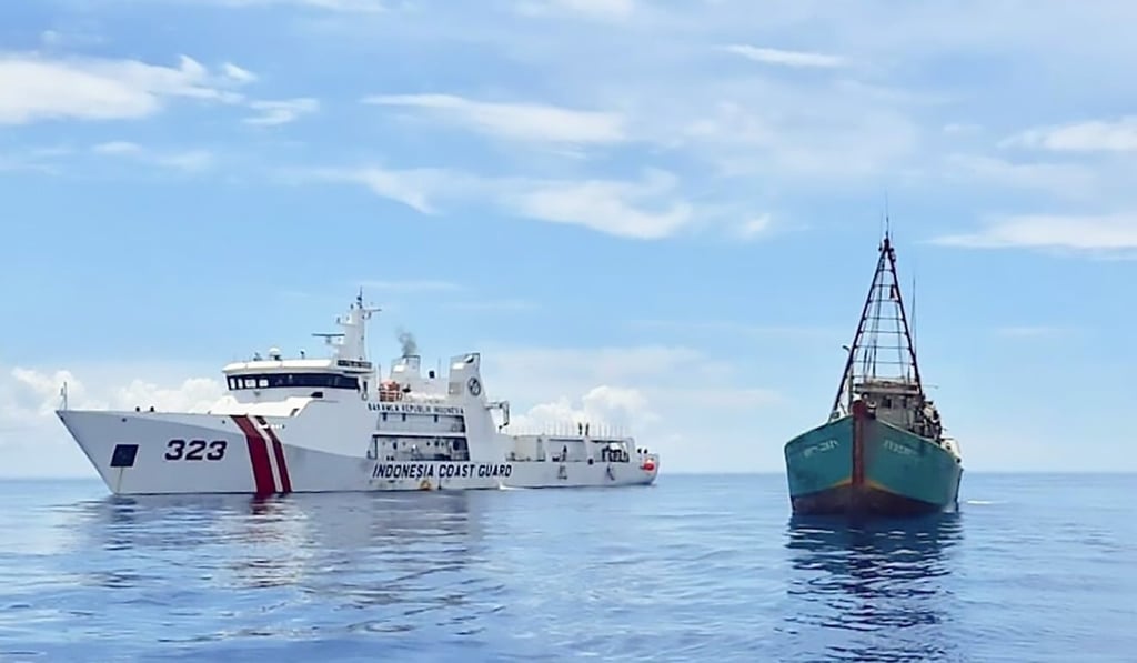An Indonesian coastguard ship next to a Vietnamese fishing vessel. Photo: AFP An Indonesian coastguard ship next to a Vietnamese fishing vessel. Photo: AFP