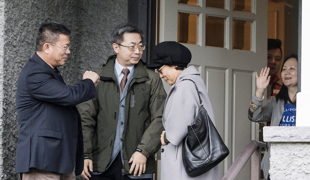 Huawei’s chief financial officer Meng Wanzhou, right, waves goodbye to visitors from China’s consulate at her home in Vancouver on December 12, 2018. They include Consul General Tong Xiaoling (second from right). Photo: The Canadian Press via AP Huawei’s chief financial officer Meng Wanzhou, right, waves goodbye to visitors from China’s consulate at her home in Vancouver on December 12, 2018. They include Consul General Tong Xiaoling (second from right). Photo: The Canadian Press via AP