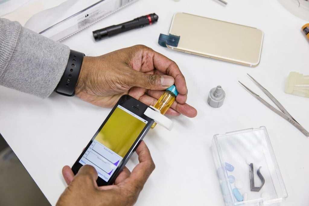 The IBM Crypto Anchor Verifier attaches to a smartphone to provide a suite of sophisticated optical tools for detecting fakes. Photo: IBM The IBM Crypto Anchor Verifier attaches to a smartphone to provide a suite of sophisticated optical tools for detecting fakes. Photo: IBM