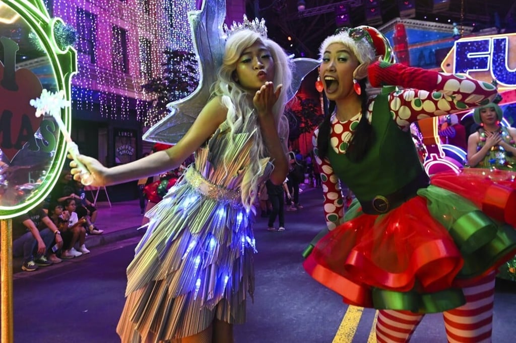 Performers take part in a parade during the launch of Universal Christmas at Universal Studios in Singapore last year. Photo: AFP