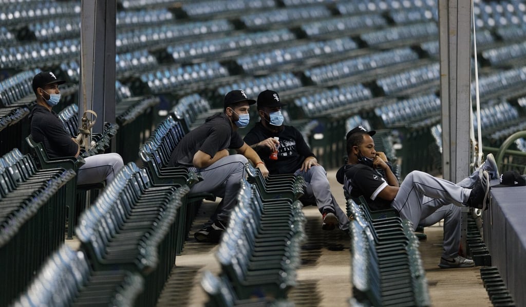 Chicago White Sox players sit in the stands during the first inning against the Milwaukee Brewers at Miller Park. Photo: USA Today