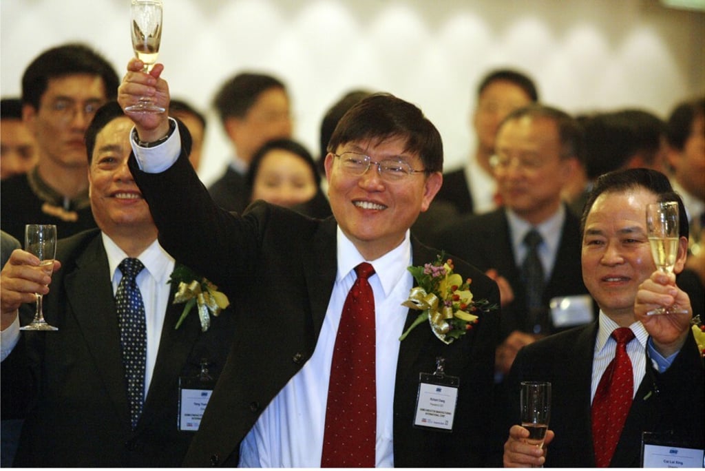 Semiconductor Manufacturing International Corp founder Richard Chang Rugin, centre, toasts the listing of the Shanghai-based contract chip maker at the Hong Kong stock exchange on March 18, 2004. Photo: SCMP