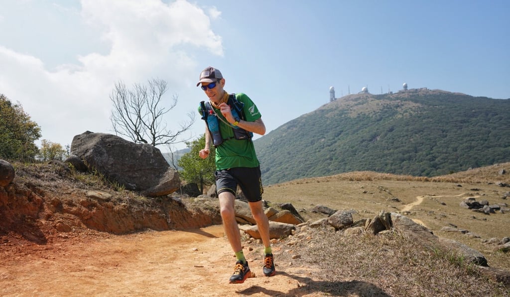 Will Hayward on his way to surviving the Hong Kong Four Trails Ultra Challenge, now has to train in a Watsons 3D mask. Photo: Lloyd Belcher