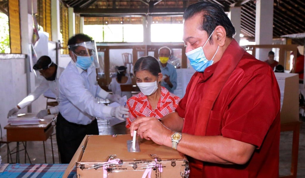 Sri Lanka's Prime Minister Mahinda Rajapaksa casts his ballot at a polling station in the village of Madamulana on Wednesday. Photo: Department of Government Information handout via AFP