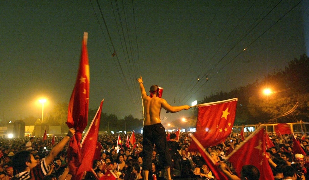 Chinese fans demonstrate outside the stadium after the defeat. Photo: Reuters