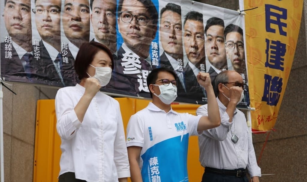DAB chairperson Starry Lee Wai-king (left) shows her support on July 22 for colleague Gary Chan Hak-kan (centre), who was set to run for re-election in the now postponed Legco election. Photo: May Tse