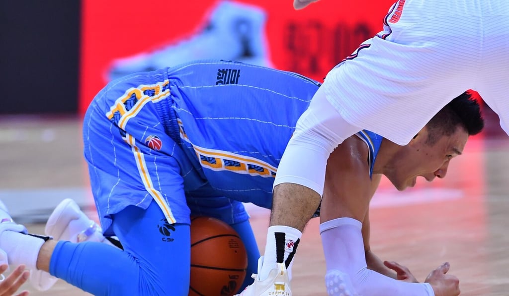 Jeremy Lin battles for the ball in the game.