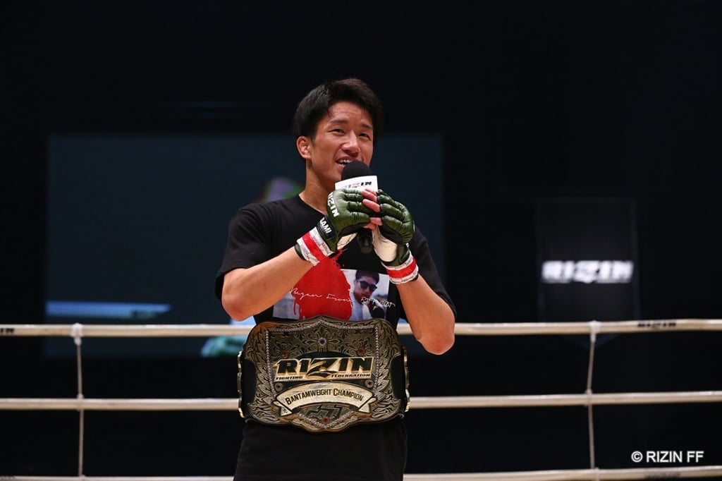 Kai Asakurua speaks to the crowd after winning the bantamweight title.